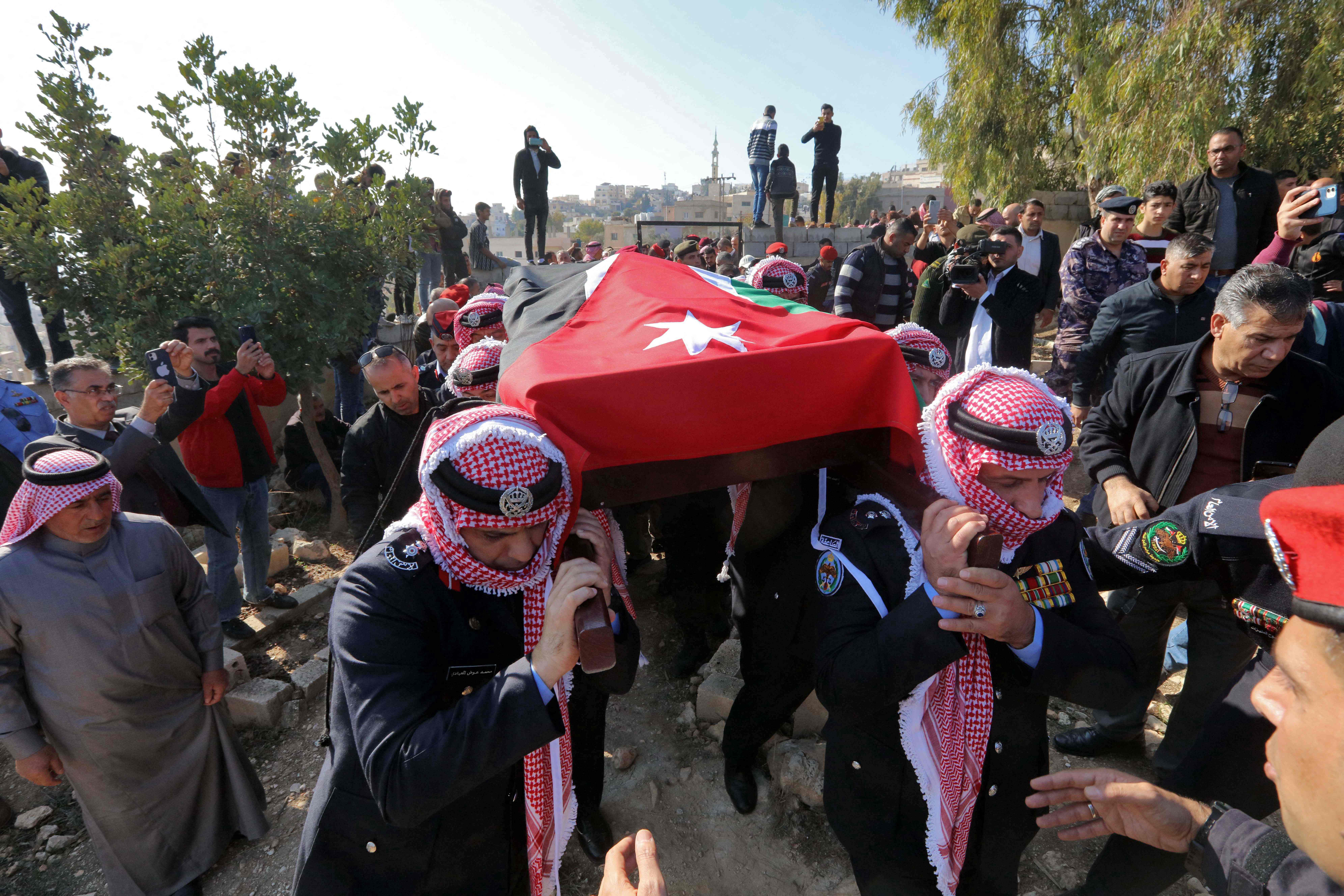 JERASH, Jordan: Jordanian military personnel take part on Dec 16, 2022 in the funeral procession of a senior police officer who was killed in riots. – AFP