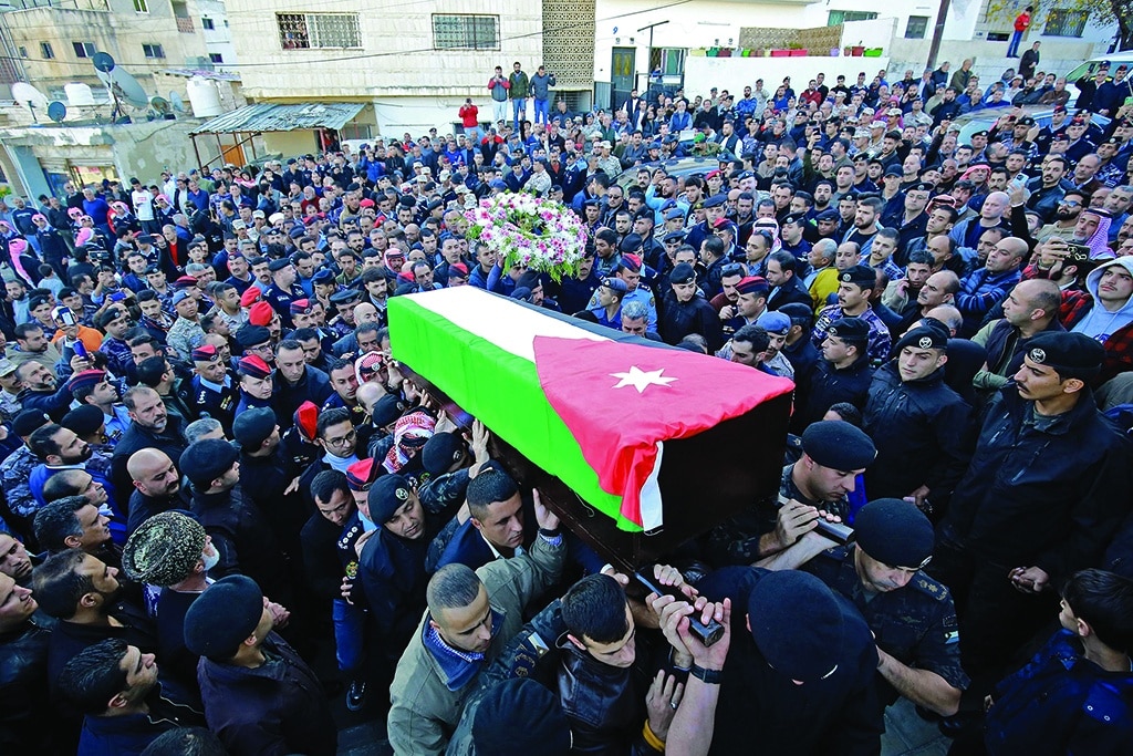 AMMAN: Jordanian military personnel carry the coffin of Captain Ghaith Al-Rahahleh, who was killed in riots last week, in the capital's Sweileh district on Dec 19, 2022. - AFP