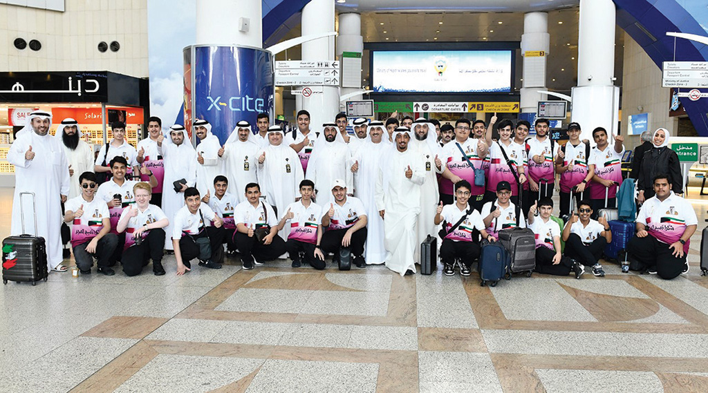 KUWAIT: Teachers and students of Balat Al-Shuhada School pose at the airport before departing for Doha on Dec 1, 2022. - KUNA