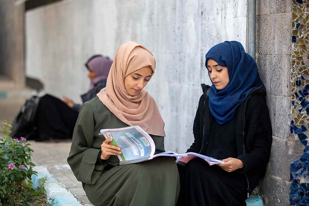 TAEZ: Yemeni women read at a university in Yemen's third city on Dec 15, 2022. - AFP