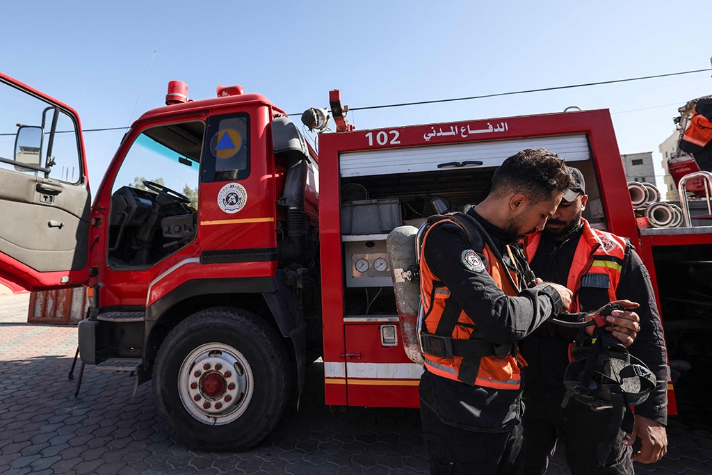 GAZA: Palestinian firefighters stand in front of a firetruck at the headquarters of the civil defense unit in Gaza City on Nov 23, 2022. – AFP
