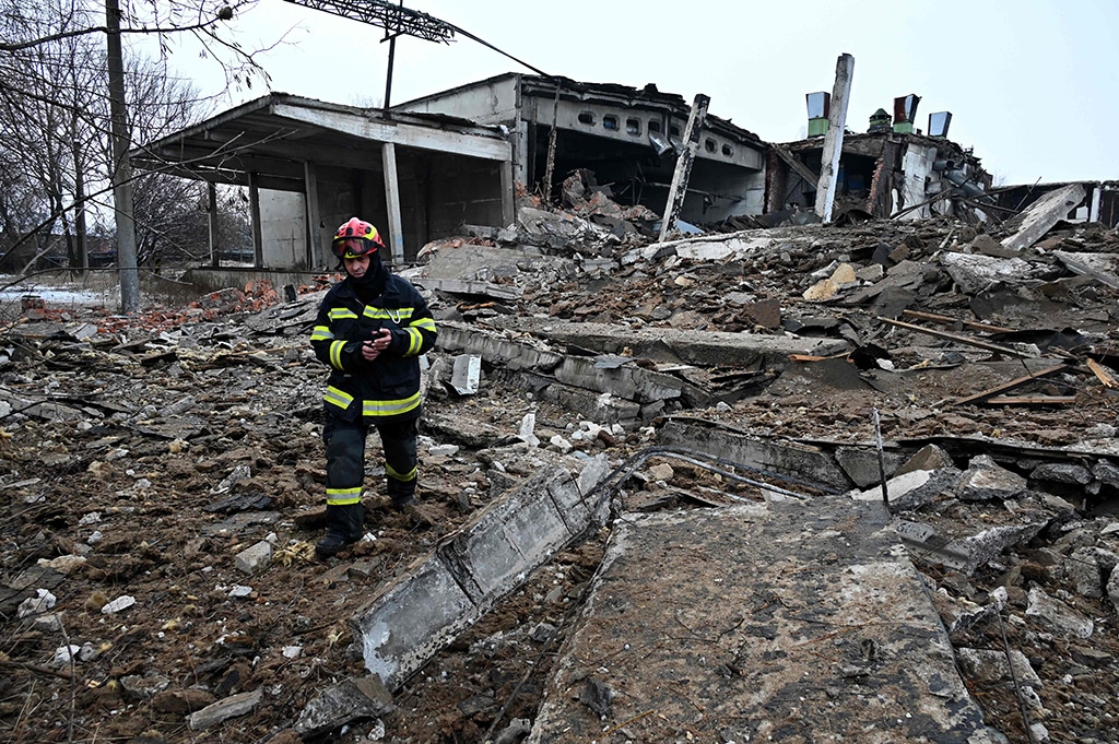 KHARKIV: A rescuer walks amid rubbles of a destroyed building following Russian strikes on Dec 16, 2022. – AFP