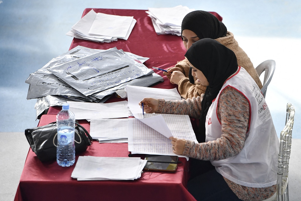 TUNIS: Members of the Tunisian electoral commission count votes on December 18, 2022 in Tunis, a day after voters overwhelmingly snubbed the elections for a neutered parliament. – AFP