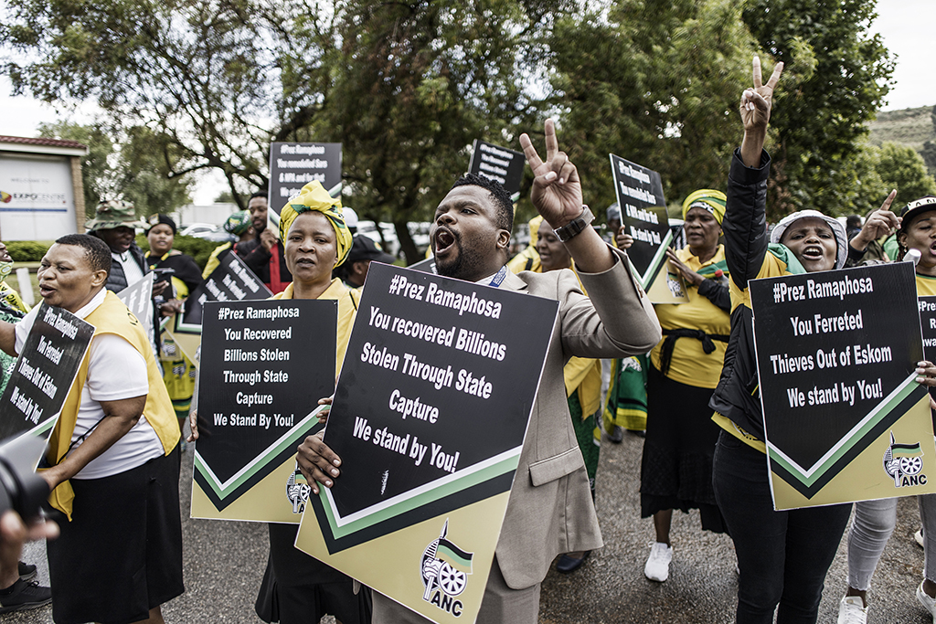 JOHANNESBURG: Supporters of South African President Cyril Ramaphosa show their support outside the NASREC Centre in Johannesburg. – AFP