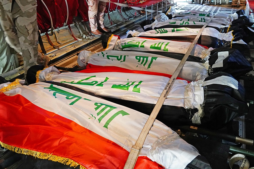KIRKUK: The bodies of Iraq's federal police members who were killed in an IS attack are repatriated from Kirkuk airport on Dec 18, 2022. – AFP
