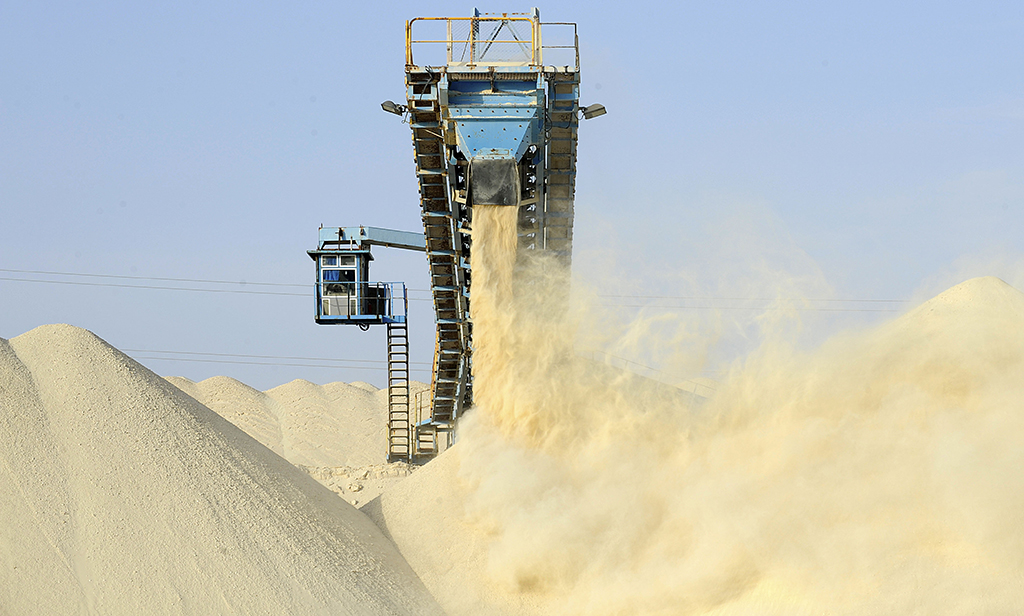 LAAYOUNE, Undefined: This file photo shows untreated phosphate being dropped off on a mountain at the end of a conveyor belt at the Marca factory of the National Moroccan phosphates company (OCP/public), near Laayoune, the main city of Moroccan-controlled Western Sahara. - AFP