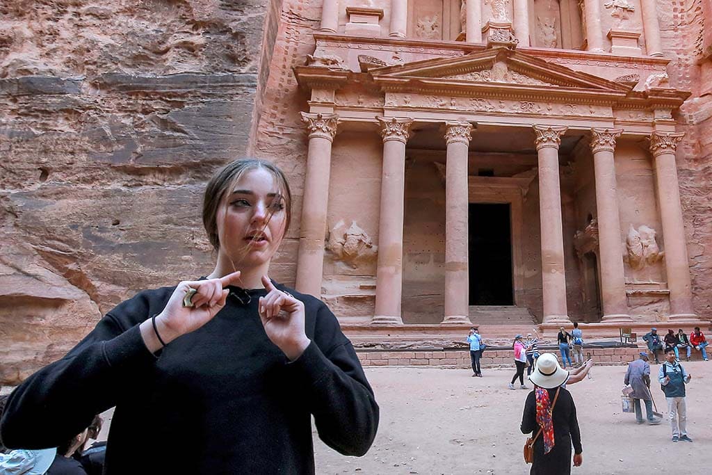 Alia, a 16-year-old French tourist, gives an interview as she stands near the Treasury in the ruins of the ancient Nabatean city of Petra in southern Jordan.