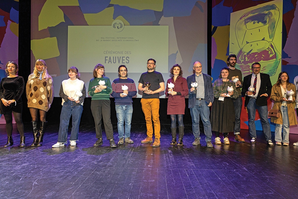 Prize recipients gather on the stage during the 50th Angouleme International Comics Festival, in Angouleme, western France.— AFP photos