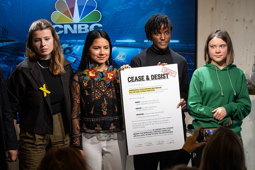 DAVOS, Switzerland: German climate activist of the “Fridays for Future” movement Luisa Neubauer (left), Ecuadorian environmental and human rights activist Helena Gualinga (second left), Ugandan climate justice activist Vanessa Nakate (second right) and Swedish climate activist Greta Thunberg (right) pose with a letter to CEOs of fossil fuel companies during the World Economic Forum (WEF) annual meeting in Davos.— AFP