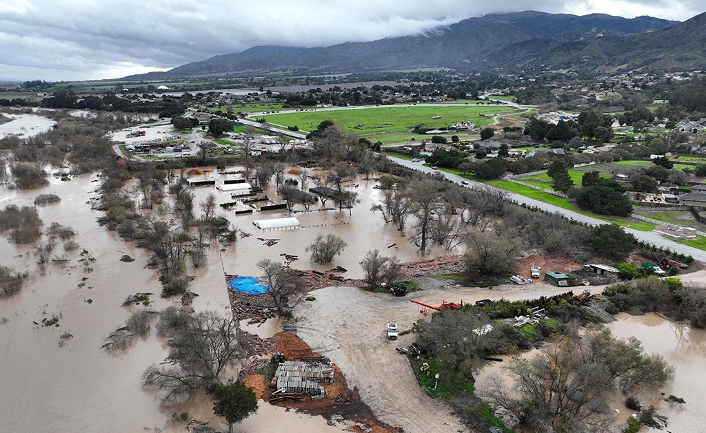 SALINAS, California: In an aerial view, floodwaters cover an agricultural area after the Salinas River overflowed its banks.— AFP