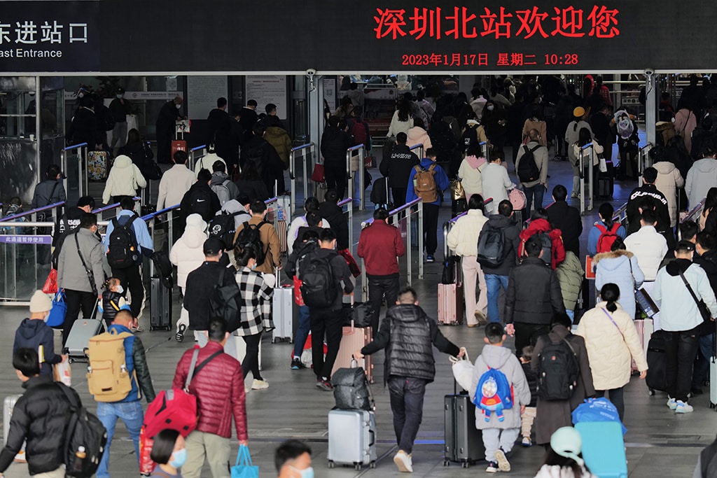 SHENZHEN: This photo shows passengers arriving at Shenzhen North railway station during peak travel ahead of the Lunar New Year of the Rabbit, in China's southern Guangdong province.- AFP
