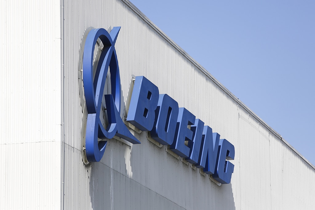 RENTON: A Boeing logo hangs on the side of a construction hangar, where Boeing 737 MAX airliners are built, in Renton, Washington. Boeing has reported a fourth-quarter loss of $634 million on January 25, 2023, as elevated operating and supply chain costs offset a December uptick in commercial plane deliveries. -AFP