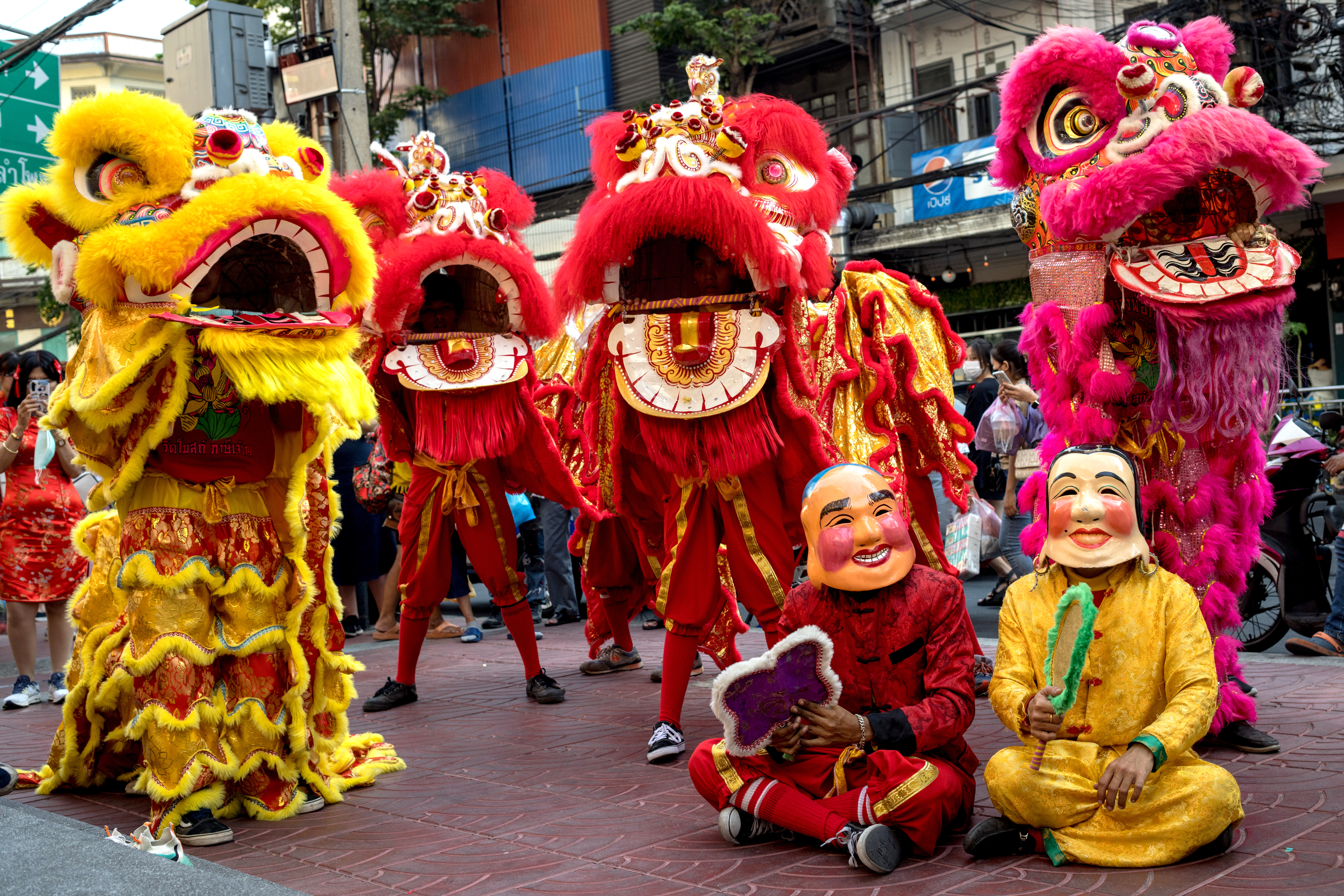 BANGKOK: Lion dancers perform on the eve of lunar new year in the Chinatown area of Bangkok on January 21, 2023. — AFP photos