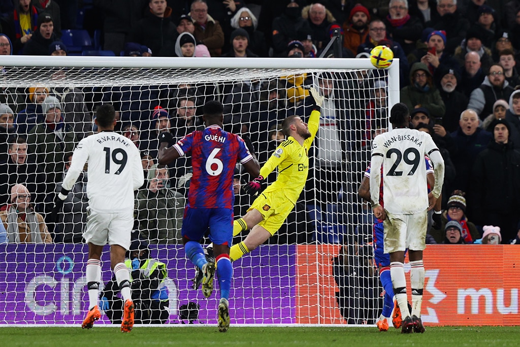 LONDON: Crystal Palace's French midfielder Michael Olise (unseen) shoots a penalty kick and scores his team first goal past Manchester United's Spanish goalkeeper David de Gea (C) during the English Premier League football match between Crystal Palace and Manchester United. – AFP