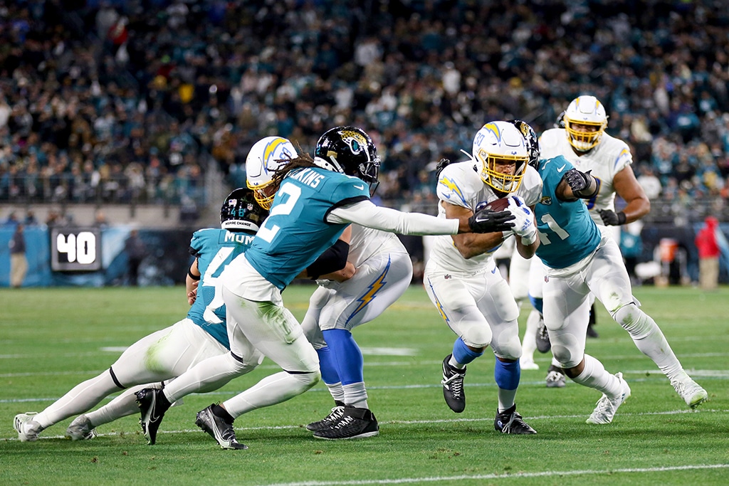JACKSONVILLE: Austin Ekeler #30 of the Los Angeles Chargers carries the ball against the Jacksonville Jaguars during the first half of the game in the AFC Wild Card playoff game at TIAA Bank Field in Jacksonville, Florida. – AFP