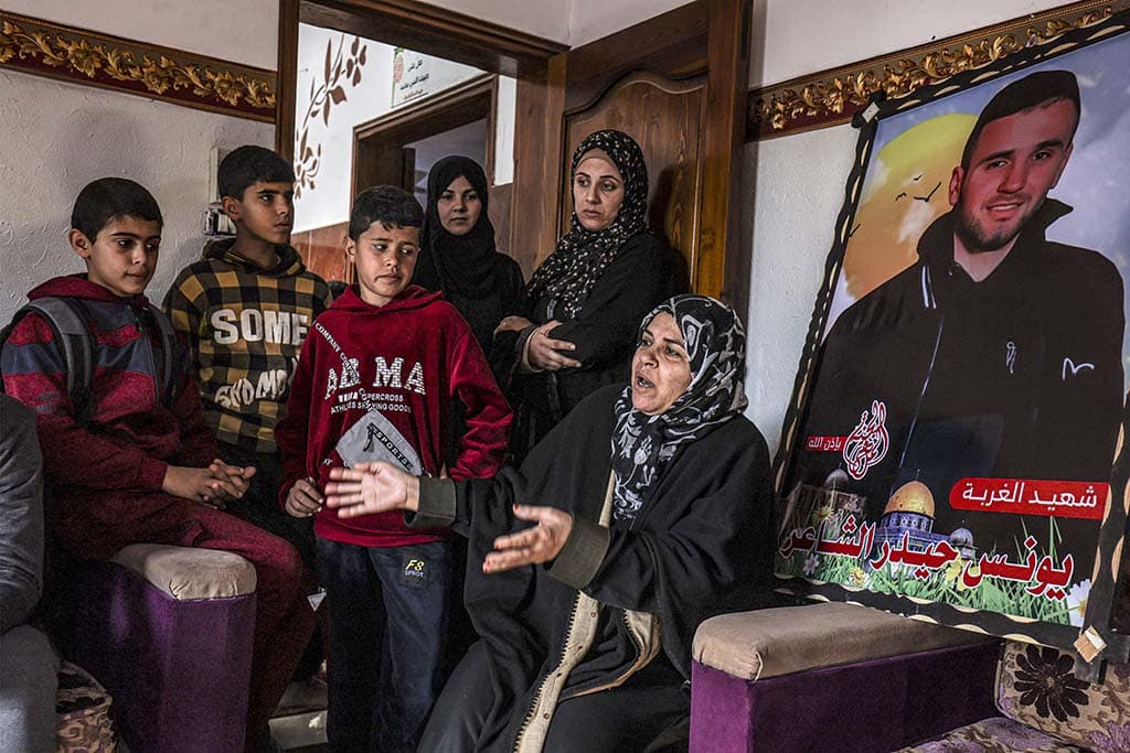 GAZA CITY: Monira (R), the 58-year-old aunt of Palestinian Yunis al-Shaer, one of eight young Palestinian men who drowned two months prior off the coast of Tunisia in a clandestine migration attempt to Europe, speaks during an interview at their house in Rafah the southern Gaza Strip on December 20, 2022. – AFP