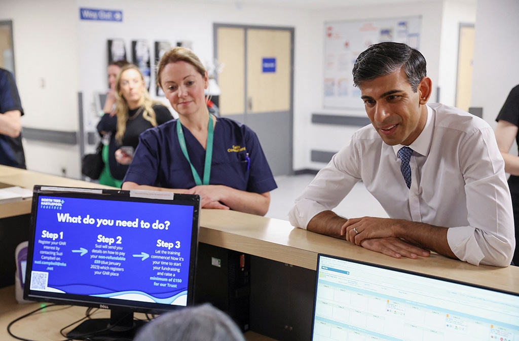 STOCKTON-ON-TEES: Britain's Prime Minister Rishi Sunak (R) speaks to staff during a visit to the University Hospital of North Tees in Stockton-on-Tees. - AFP