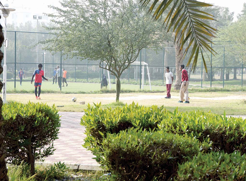 KUWAIT:  People play football in Salmiya garden on a chilly morning. – Photo by Fouad Al-Shaikh