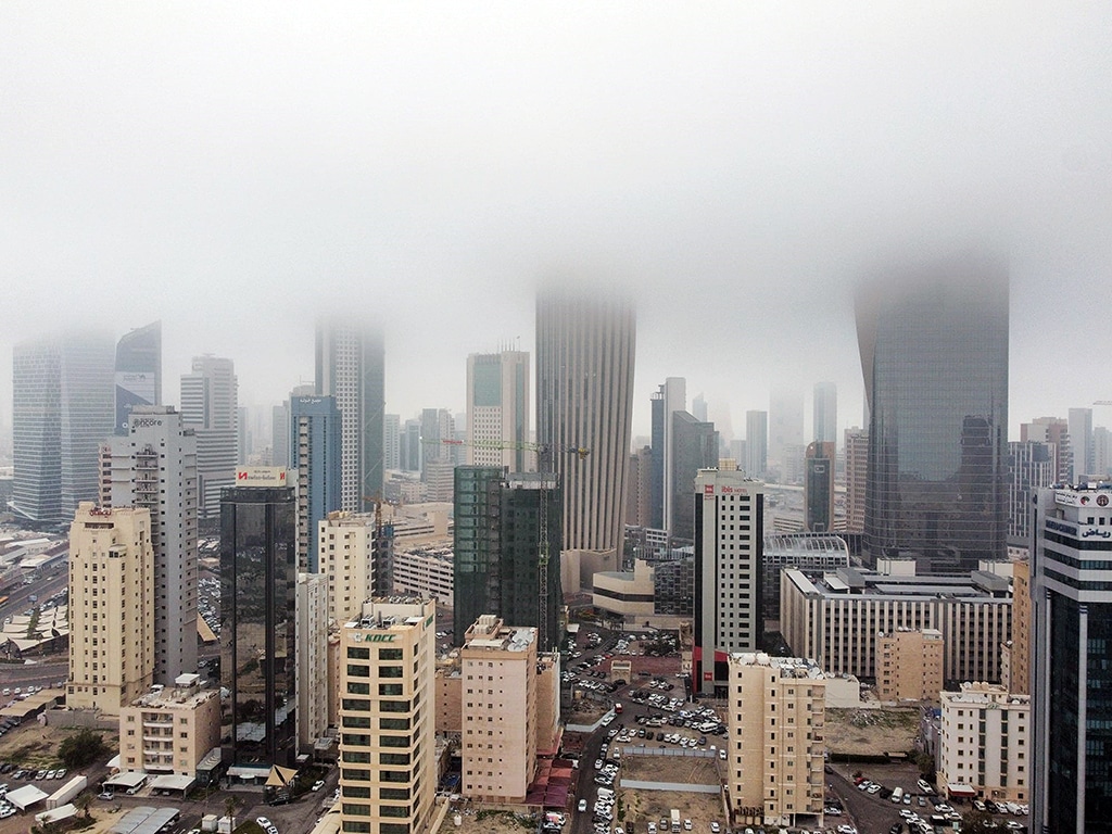 KUWAIT: A thick blanket of fog covers skyscrapers in downtown Kuwait on Sunday.- Photo by Yasser Al-Zayyat