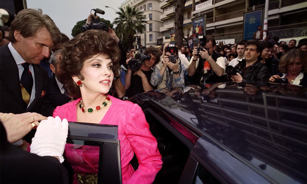 In this file photo taken on May 11, 1991, Italian actress Gina Lollobrigida stands next to a car during the 44th Cannes Film Festival in Cannes, southern France.