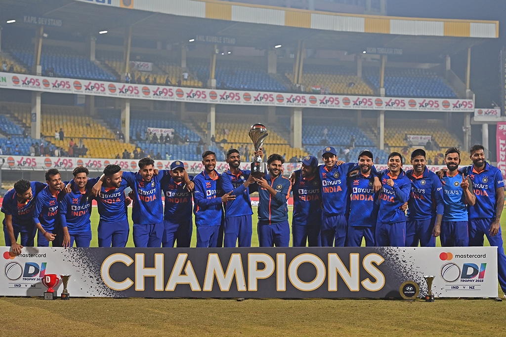 INDORE: India's players pose with the trophy after winning the third and final one-day international cricket match against New Zealand at the Holkar Cricket Stadium on Jan 24, 2023. - AFP