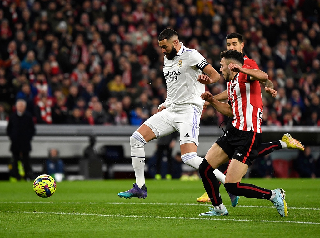 BILBAO: Real Madrid's French forward Karim Benzema fights for the ball with Athletic Bilbao's Spanish defender Aitor Paredes at the San Mames stadium on Jan 22, 2023. - AFP
