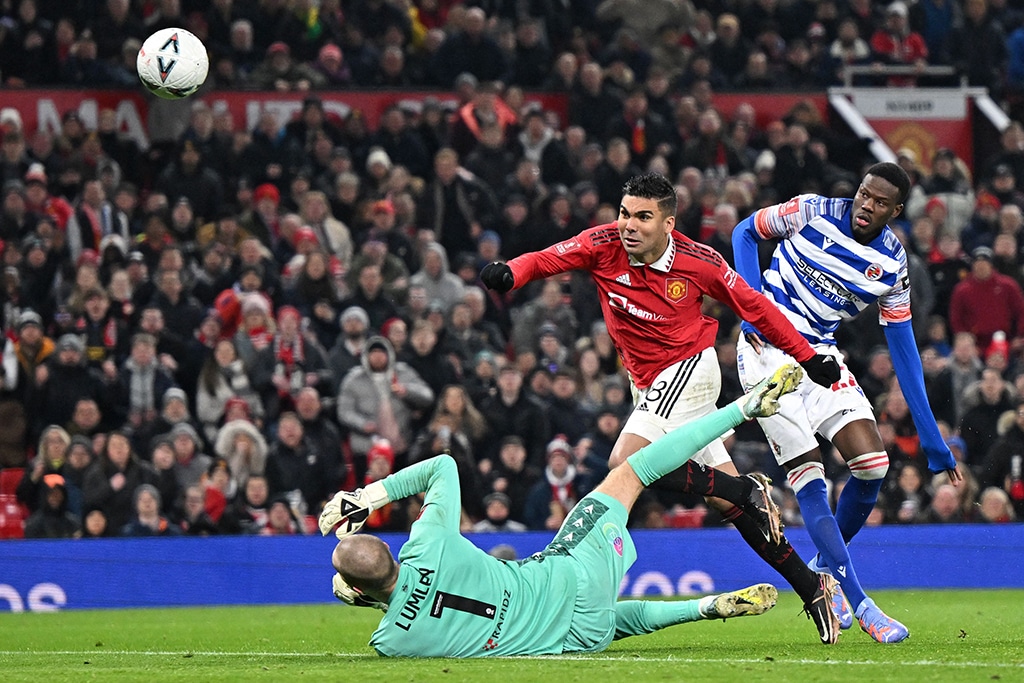 MANCHESTER: Manchester United's Brazilian midfielder Casemiro scores the opening goal of the English FA Cup fourth round football match against Reading at Old Trafford on Jan 28, 2023. - AFP