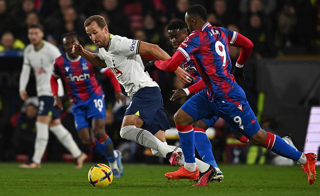LONDON: Tottenham Hotspur's English striker Harry Kane is challenged by Crystal Palace's French-born Ghanaian striker Jordan Ayew at Selhurst Park on Jan 4, 2023. – AFP