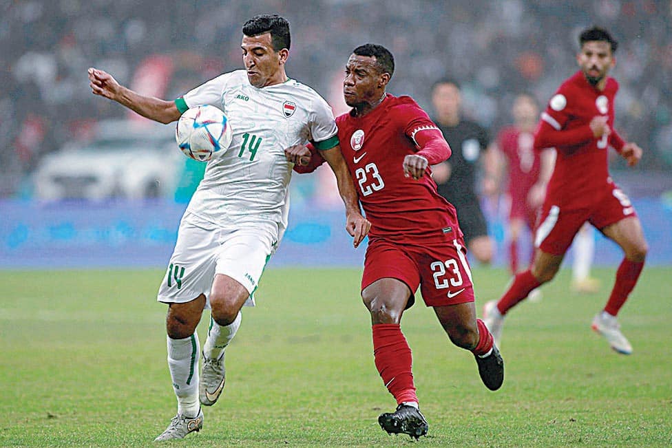 BASRA: Iraq's midfielder Hussein Jabbar fights for the ball with Qatar's midfielder Assim Madibo during the Arabian Gulf Cup semifinal match at the Basra International Stadium on Jan 16, 2023. – AFP