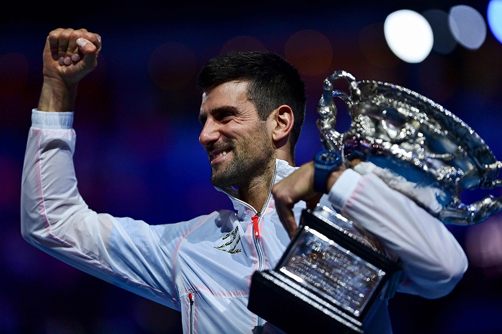 MELBOURNE: Serbia's Novak Djokovic celebrates with the Norman Brookes Challenge Cup trophy following his victory against Greece's Stefanos Tsitsipas at the Australian Open on Jan 29, 2023. - AFP