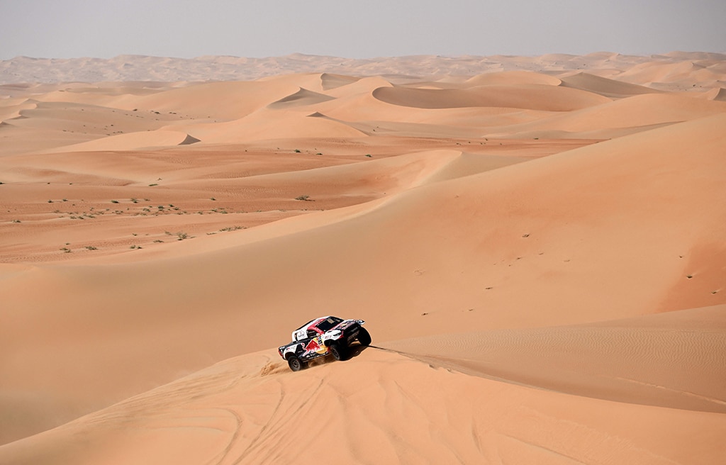 SHAYBAH, Saudi Arabia: Toyota's driver Nasser Al-Attiyah of Qatar and his co-driver Mathieu Baumel of France compete during the Stage 10 of the Dakar 2023 between Haradh and Shaybah on Jan 11, 2023. – AFP