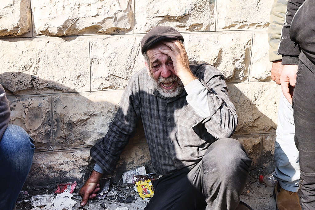 JENIN, Palestinian Territories:  An elderly Palestinians man mourns the death one of the 9 reported victims killed during a Zionist raid on the West Bank's Jenin refugee camp.- AFP