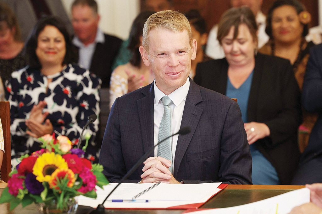 WELLINGTON: New Zealand's new Prime Minister Chris Hipkins smiles as he is sworn in by Governor General Dame Cindy Kiro at the Government House on Jan 25, 2023. - AFP