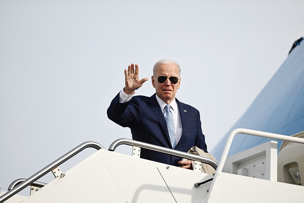 US President Joe Biden boards Air Force One at Joint Base Andrews in Maryland on Jan 8, 2023. - AFP