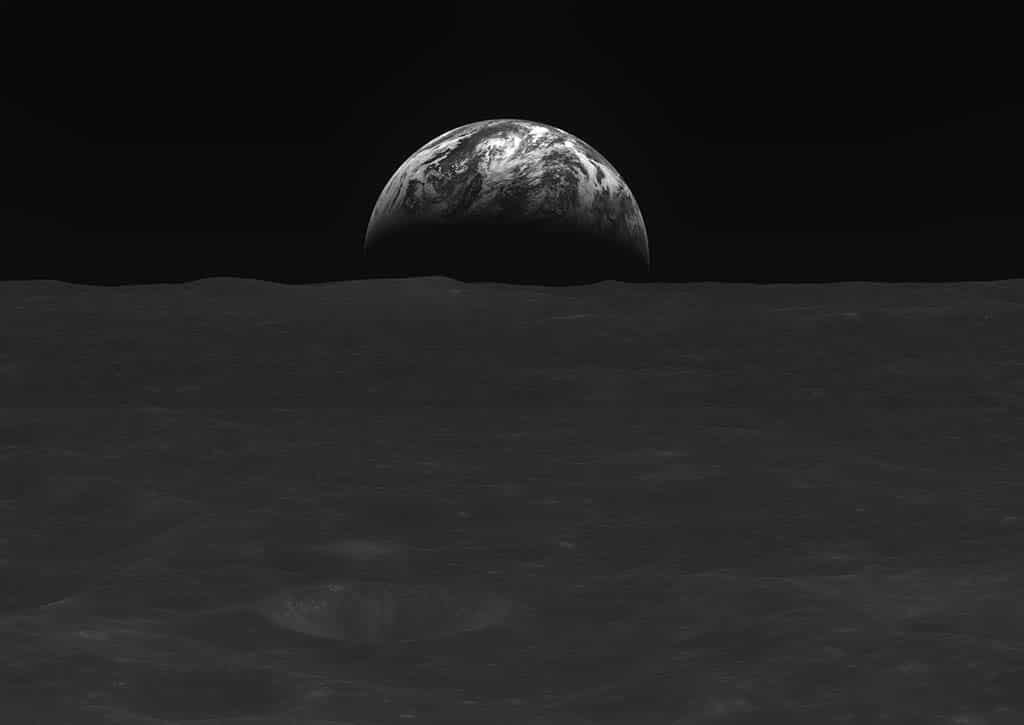 Handout image provided on Jan 3, 2023 shows a black-and-white image of the Moon’s surface and Earth taken by South Korean lunar orbiter Danuri. – AFP