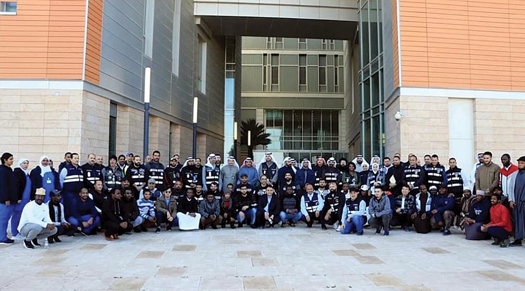 KUWAIT: Participants of the mock evacuation drill pose for a picture.