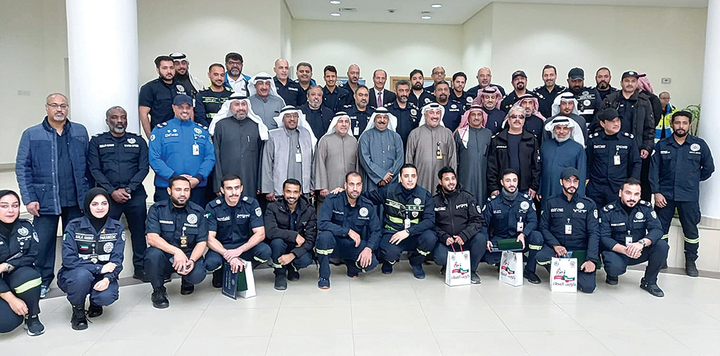 Officials with the members of the Emergency Medical Department.