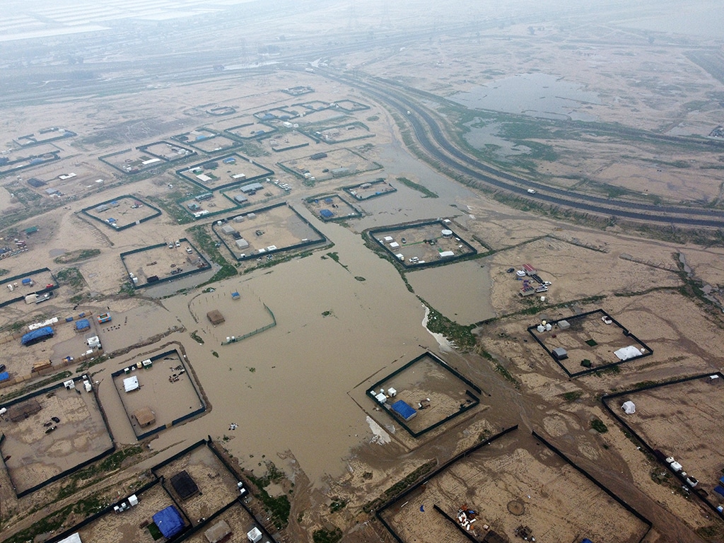 KUWAIT: Inundated desert camps in Sulaibiya area on Tuesday following incessant rains. – Photos by Yasser Al-Zayyat