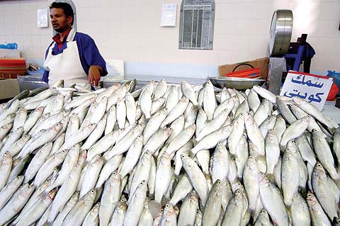 KUWAIT: A fish vendor sells fish in a market in Kuwait City.