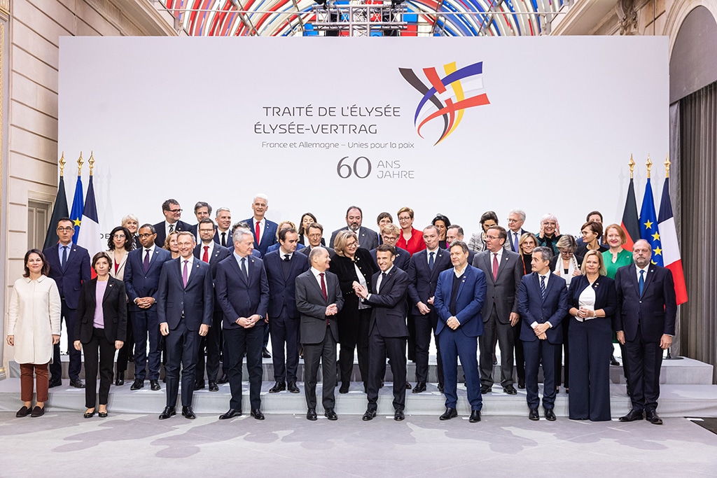 PARIS: French President Emmanuel Macron and Chancellor of Germany Olaf Scholz pose for a group picture with the members of their respective cabinets, prior to a cabinet meeting, as part of the celebration of the 60th anniversary of the signing of the Elysee Treaty, to seal reconciliation between France and West Germany, 18 years after the Second World War at the presidential Elysee Palace in Paris on January 22, 2023. - AFP