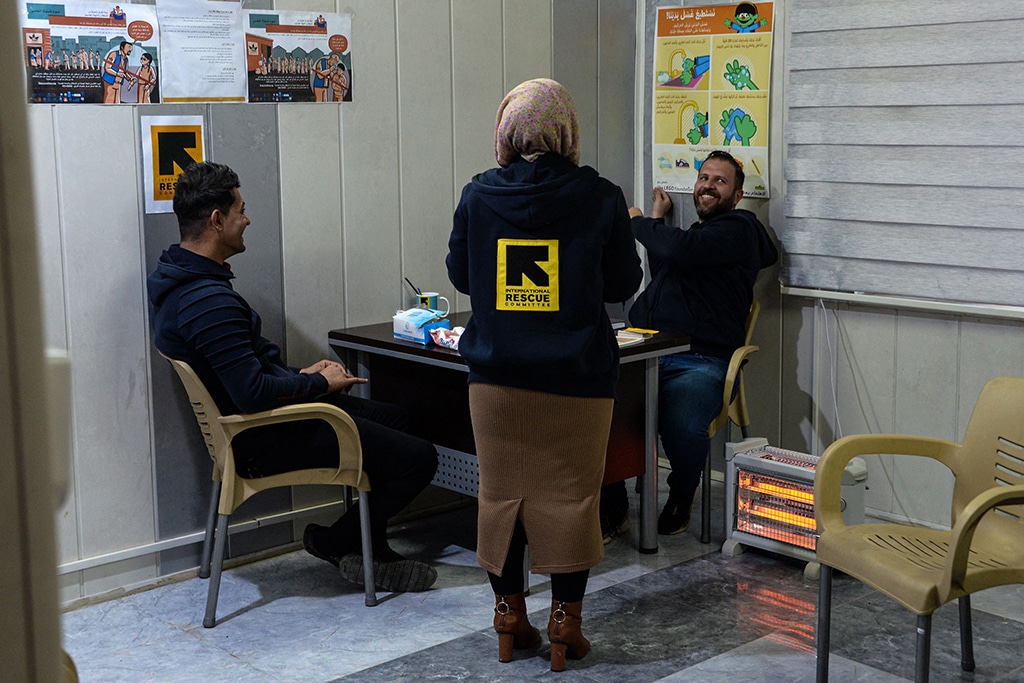 MOSUL: Hussein Adnan (L) who lost his ID card while fleeing the battle against the Islamic State (IS) group in 2017, is pictured in the offices of the International Rescue Committee (IRC) in Iraq's northern city of Mosul. – AFP