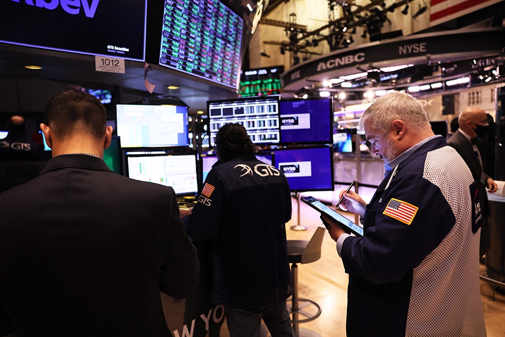 NEW YORK: Traders work on the floor of the New York Stock Exchange (NYSE) during trading in New York City. – AFP
