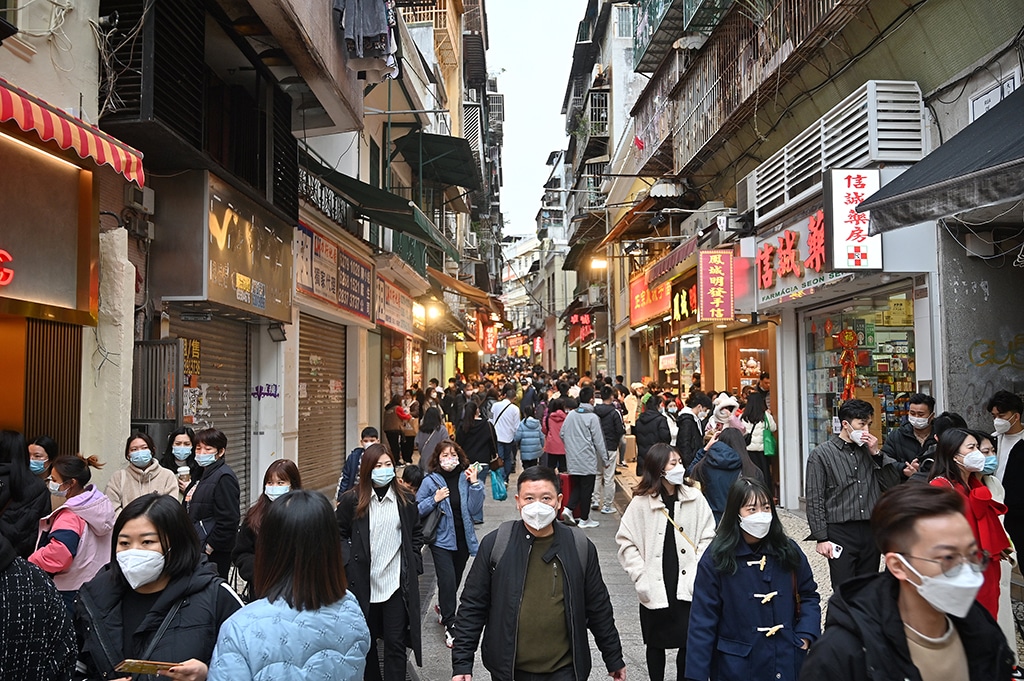 MACAU: This photo shows tourists from mainland China strolling down a street in the southern Chinese enclave of Macau. Streets were packed in the run up to the Lunar New Year after pandemic controls were abruptly lifted, but Macau remains far from business as usual as the Chinese casino hub wrestles with questions about its future. – AFP