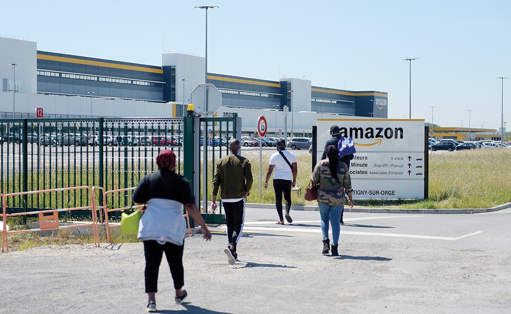 BRÉTIGNY-SUR-ORGE, France: In this file photo, Amazon workers arrive at the company's centre in Bretigny-sur-Orge as Amazon France partially reopens amid the pandemic of the novel coronavirus (COVID-19). - AFP