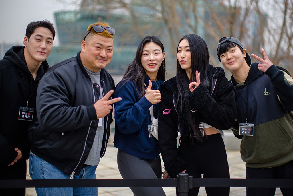 Contestants Jo Jin-Hyeong (second left) and Jang Eun-sil (center) of Netflix reality competition series Physical: 100 attend a fan event in Seoul.— AFP photos
