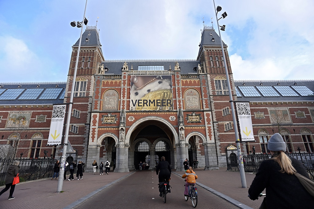 A banner advertising a Vermeer show hangs outside the Rijksmuseum in Amsterdam.— AFP photos