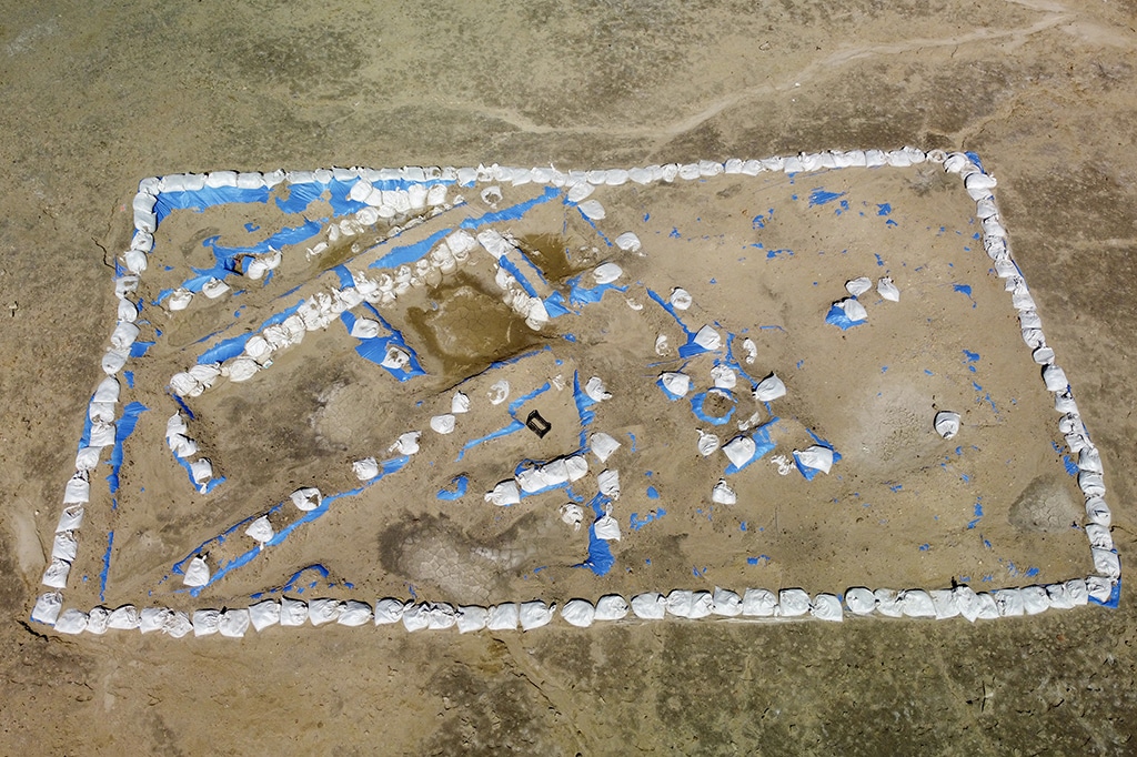 An aerial picture shows a general view of the newly-excavated trench which may have contained an inn with a cooling area for food storage, at the site of the ancient city-state of Lagash, in Iraqís al-Shatra district of the southern Dhi Qar province. — AFP photos
