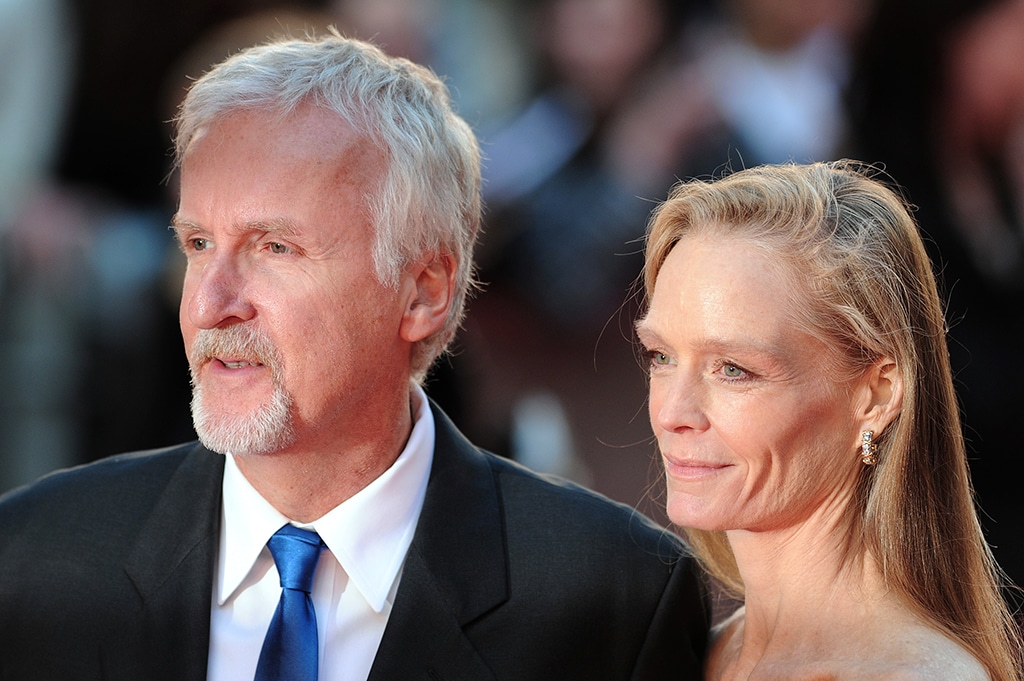 US director James Cameron (left) and his wife Suzie Amis arrive at the world premiere of Titanic 3D in central London.-AFP photos