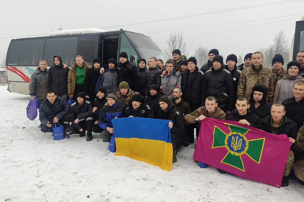 Picture released by Ukrainian Presidential Chief of Staff Andriy Yermak on February 4, 2023, shows freed Ukrainian prisoners posing following their exchange in an unknown location in Ukraine. - AFP