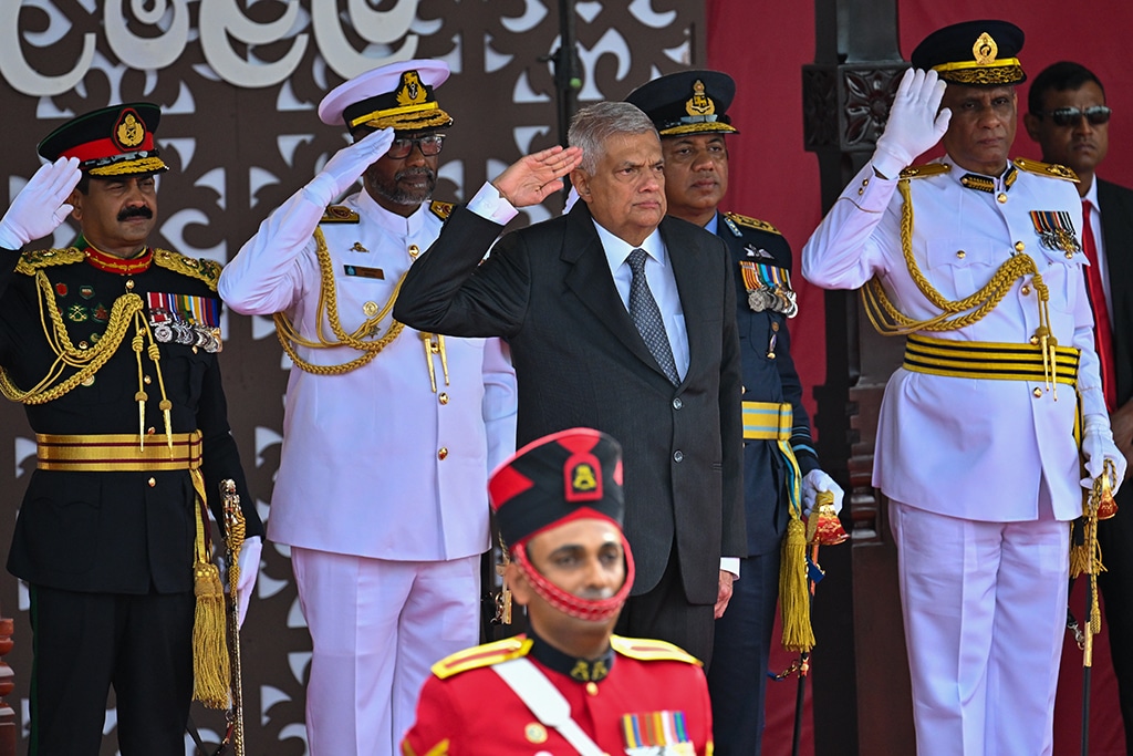 COLOMBO: Sri Lanka's President Ranil Wickremesinghe (C) salutes during Sri Lanka's 75th Independence Day celebrations in Colombo on February 4, 2023. – AFP